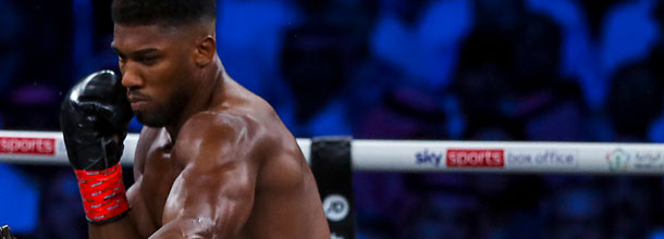 British heavyweight boxer Anthony Joshua throws a punch in the boxing ring