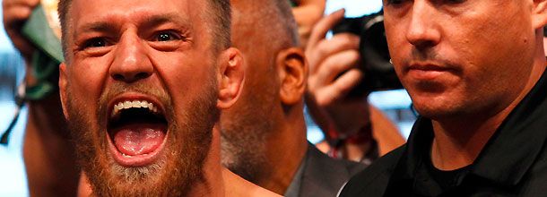 MMA fighter Conor McGregor celebrates a win in the UFC octagon