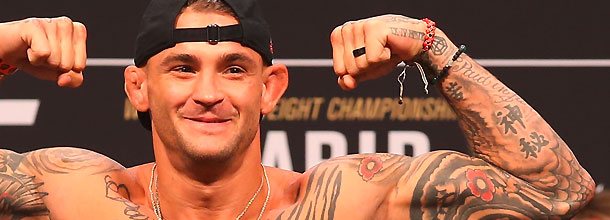 UFC star Dustin Poirier flexes his muscles before a fight