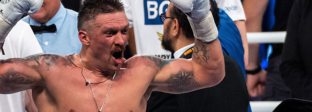 Boxer Oleksandr Usyk celebrates a win in the boxing ring