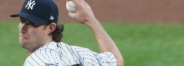 New York Yankees pitcher Gerrit Cole winds up a pitch on the mound in an MLB game