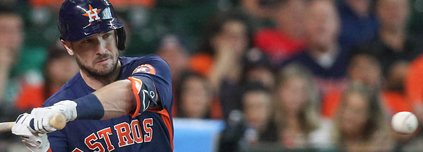 Houston Astros star Alex Bregman hits a pitch during an MLB game
