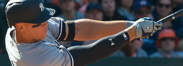 New York Yankees baseball star Aaron Judge hits a home run during an MLB game