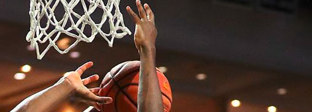 NBA basketball players battle for the ball under the basket