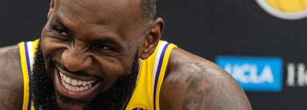 Los Angeles Lakers basketball star LeBron James laughs during an NBA preseason press conference