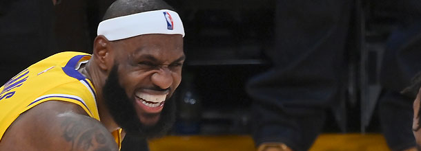 Los Angeles Lakers basketball star LeBron James laughs in an NBA game