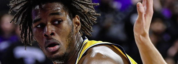 Michigan Wolverines basketball star Johnson in action in a March Madness game