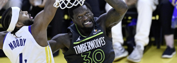 Minnesota Timberwolves and Golden State Warriors basketball players in action in an NBA game
