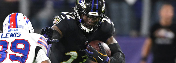 Players from the Buffalo Bills and the Baltimore Ravens in action in an NFL game