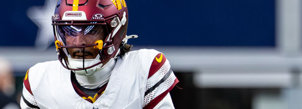 Washington Commanders QB Jayden Daniels looks downfield in an NFL game