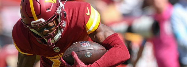 Washington Commanders WR McLaurin dives into the end zone for a touchdown during an NFL game