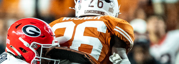 College Football players from the Texas Longhorns and the Georgia Bulldogs in action in an NCAAF game