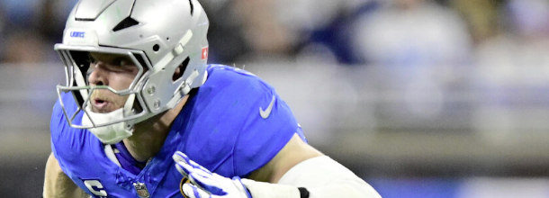 Detroit Lions football star Aidan Hutchinson looking to make a sack in an NFL game