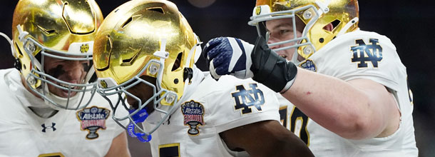 Notre Dame Fighting Irish NCAAF players celebrate a win in the College Football playoffs