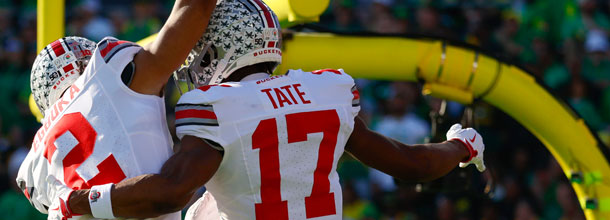 Ohio State Buckeyes football players celebrate a touchdown in an NCAAF football game