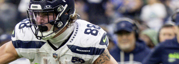 Seattle Seahawks Tight End AJ Barner scores a touchdown in an NFL game