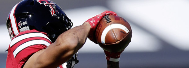 Texas Tech Red Raiders WR Virgil in action in an NCAAF game