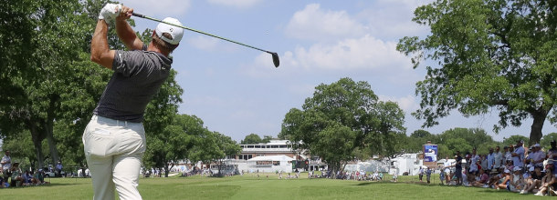 A golf player hits a shot on the PGA Tour
