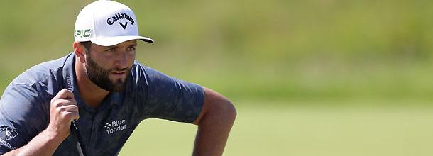 Spanish golf star John Rahm eyes up a putt on the PGA Tour