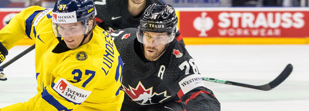 Ice hockey players from Sweden and Canada in action at the 2024 IIHF World Championships