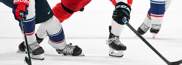 Ice hockey players battle for the puck at the IIHF World Championships