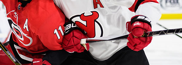 Hockey players from the New Jersey Devils and the Carolina Hurricanes in action in the NHL