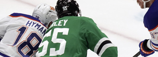 Dallas Stars and Edmonton Oilers ice hockey players in action on the NHL ice