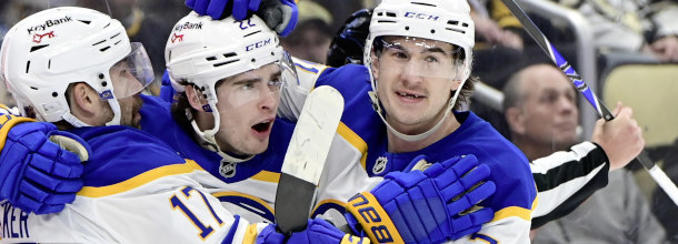 Buffalo Sabres ice hockey players celebrate a goal in a NHL game