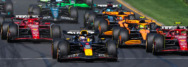 Formula 1 cars battle for position in a Grand Prix