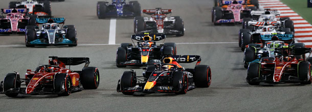 Formula 1 cars battle for position in a Grand Prix