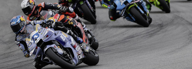 MotoGP riders battle for position during a Grand Prix
