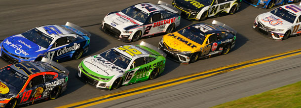NASCAR cars race around the track in a Cup Series race