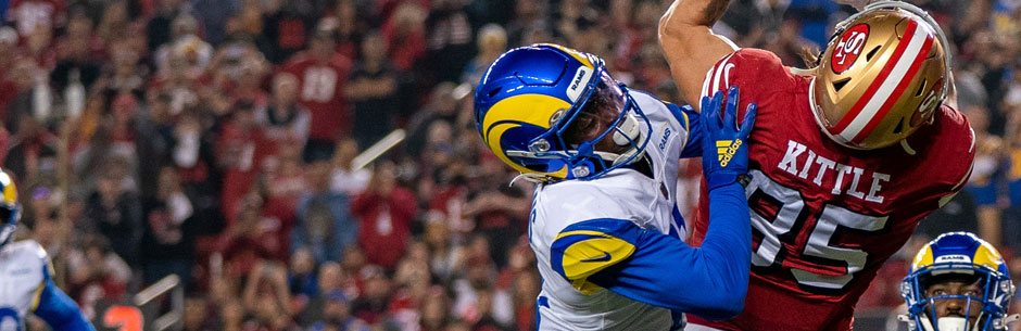 Players from the 49ers and the Rams battle for the ball in the NFL