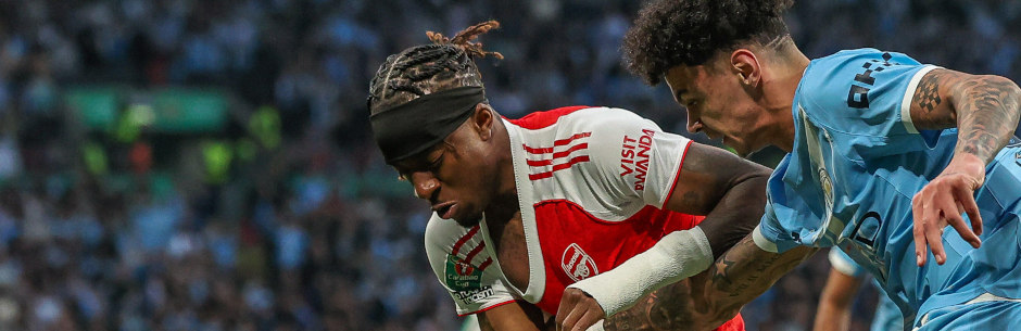 Soccer players from Arsenal and Manchester City in action in the English Premier League