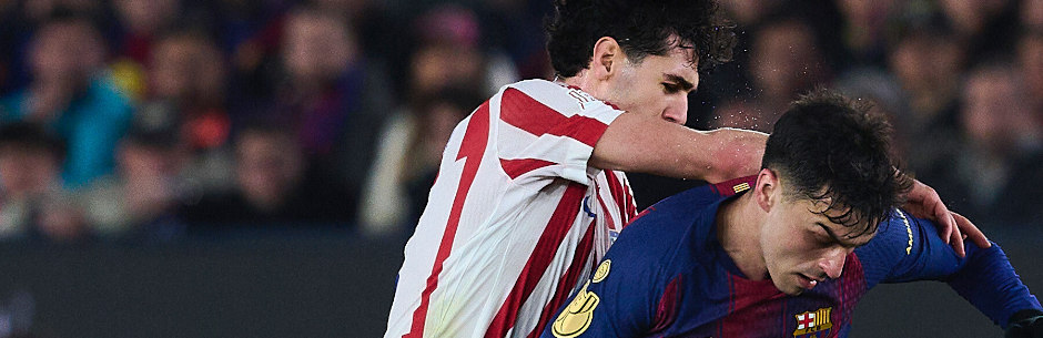 Players from Barcelona and Atletico Madrid battle for the ball in the Uefa Champions League