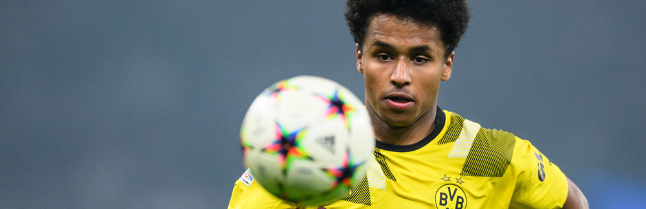 Borussia Dortmund soccer star Adeyimi chases the ball in a Uefa Champions League game