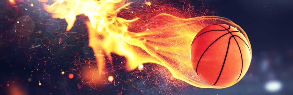 A flaming NBA basketball flies through the air