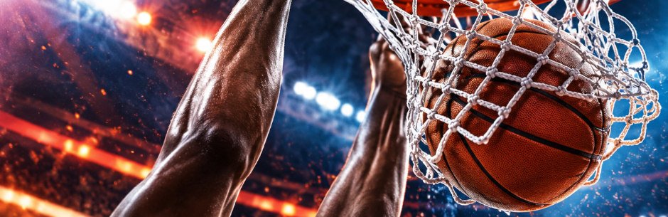 An NBA player makes a slam dunk
