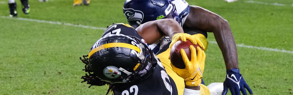 Players from the Pittsburgh Steelers and the Seattle Seahawks battle for the ball in the NFL