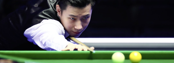 Chinese snooker star Zhao Xintong lines up a shot at the 2025 World Championships