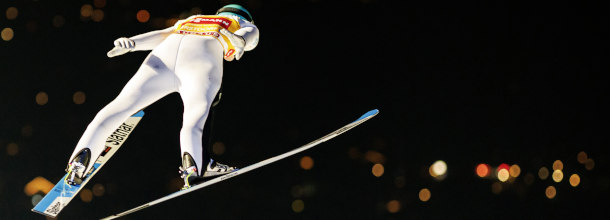 A skijumper flies through the air