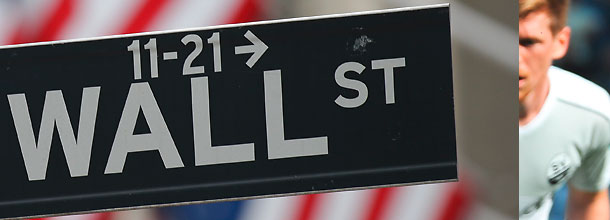 The Wall Street street sign in New York points the way to the Stock Market