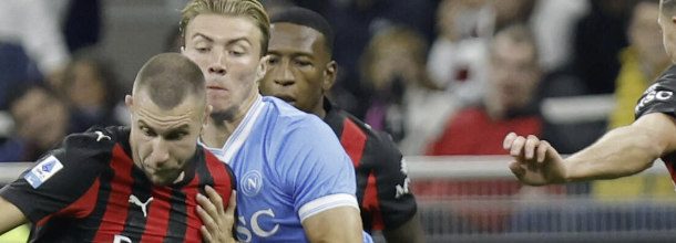 Soccer players from AC Milan and Napoli in action in Serie A
