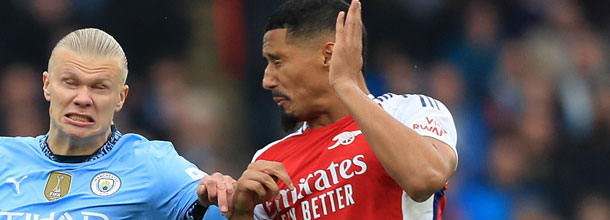 Players from Manchester City and Arsenal battle for the ball in the English Premier League