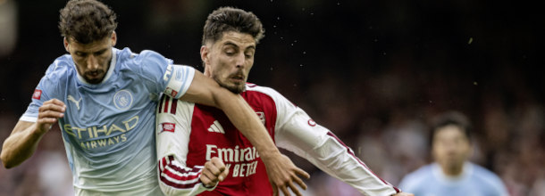 Arsenal and Manchester City soccer players in action in the English Premier League