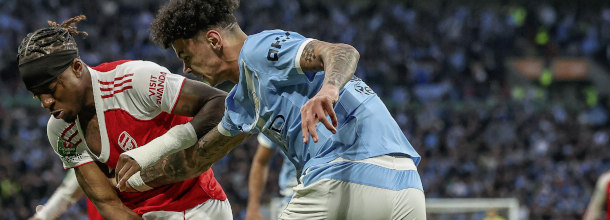 Soccer players from Manchester City and Arsenal in action in the Premier League