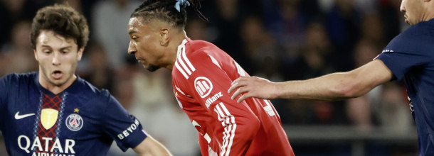 Soccer players from PSG and Bayern Munich in action in the UEFA Champions League