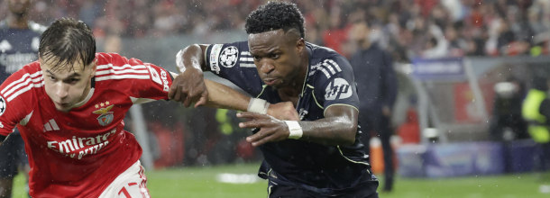Soccer players from Benfica and Real Madrid in action during a Champions League game
