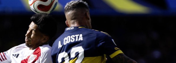 Soccer players from Boca Juniors and River Plate in action in the Superclasico duel