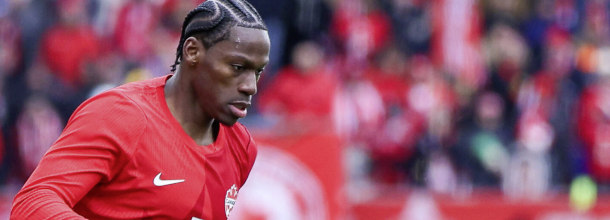 Canada soccer star David in action in a World Cup warm-up game